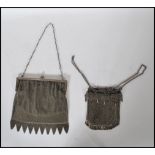 A pair of early 20th Century Edwardian ladies evening purses of silver plated / white metal mesh