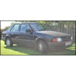 A 1990 ' G' Registration Ford Escort 1597cc ( 1.6) Ghia 5dr in black with 22000 miles on the clock (
