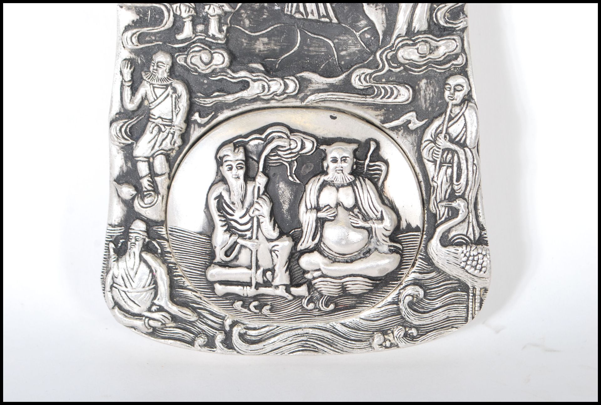 A Chinese white silver inkwell of ingot form, cast in relief with elders and Crane's central - Image 3 of 6