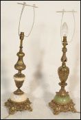 A near pair of Louis XVI style alabaster mounted gilt metal table lamps of bulbous form, each raised