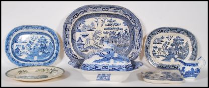 A collection of 19th Century Staffordshire blue and white willow pattern ceramics to include a large