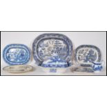 A collection of 19th Century Staffordshire blue and white willow pattern ceramics to include a large