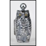 A silver plated sovereign / coin case in the form of an owl, having a hinge opening with