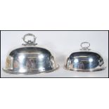 A large early 20th century silver plated meat dome cover with handle atop together with a smaller