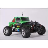 A contemporary Ranger 4WD remote control car complete with shell and the engine components etc