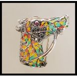 A stamped 925 silver brooch pendant in the form of a horses head having plique a jour and