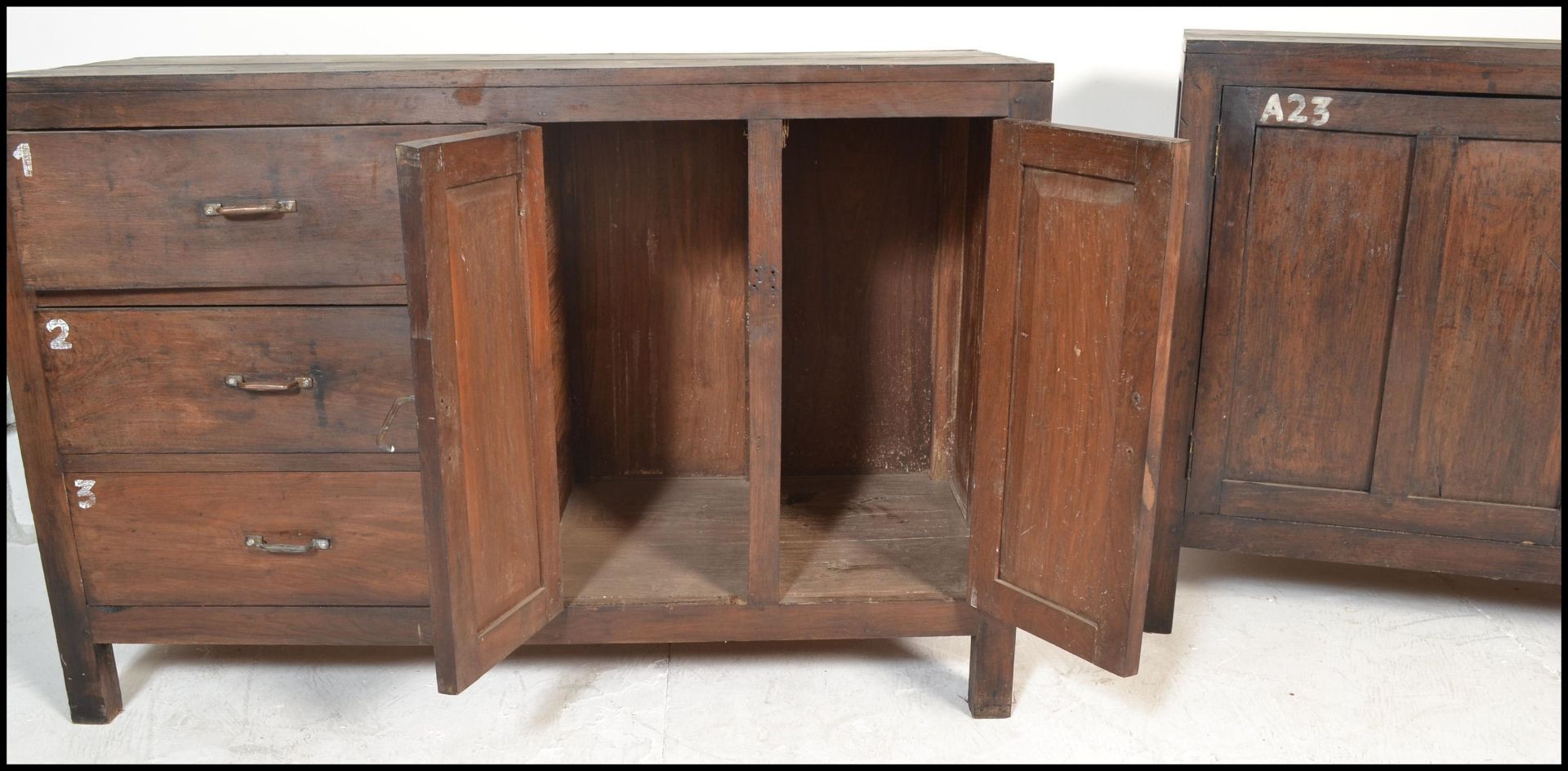 A pair of unusual 20th century hardwood sideboard cabinets of hardwood construction being raised - Bild 6 aus 17