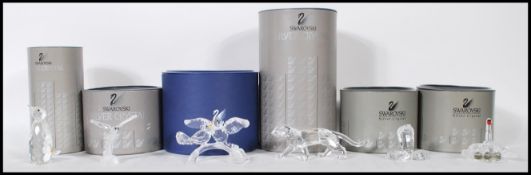 A collection of Swarovski crystal gut glass animal figurines to include a cobra, dragonfly, swan,
