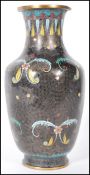 A 20th Century Chinese cloisonne baluster vase having a black ground with blue and yellow floral