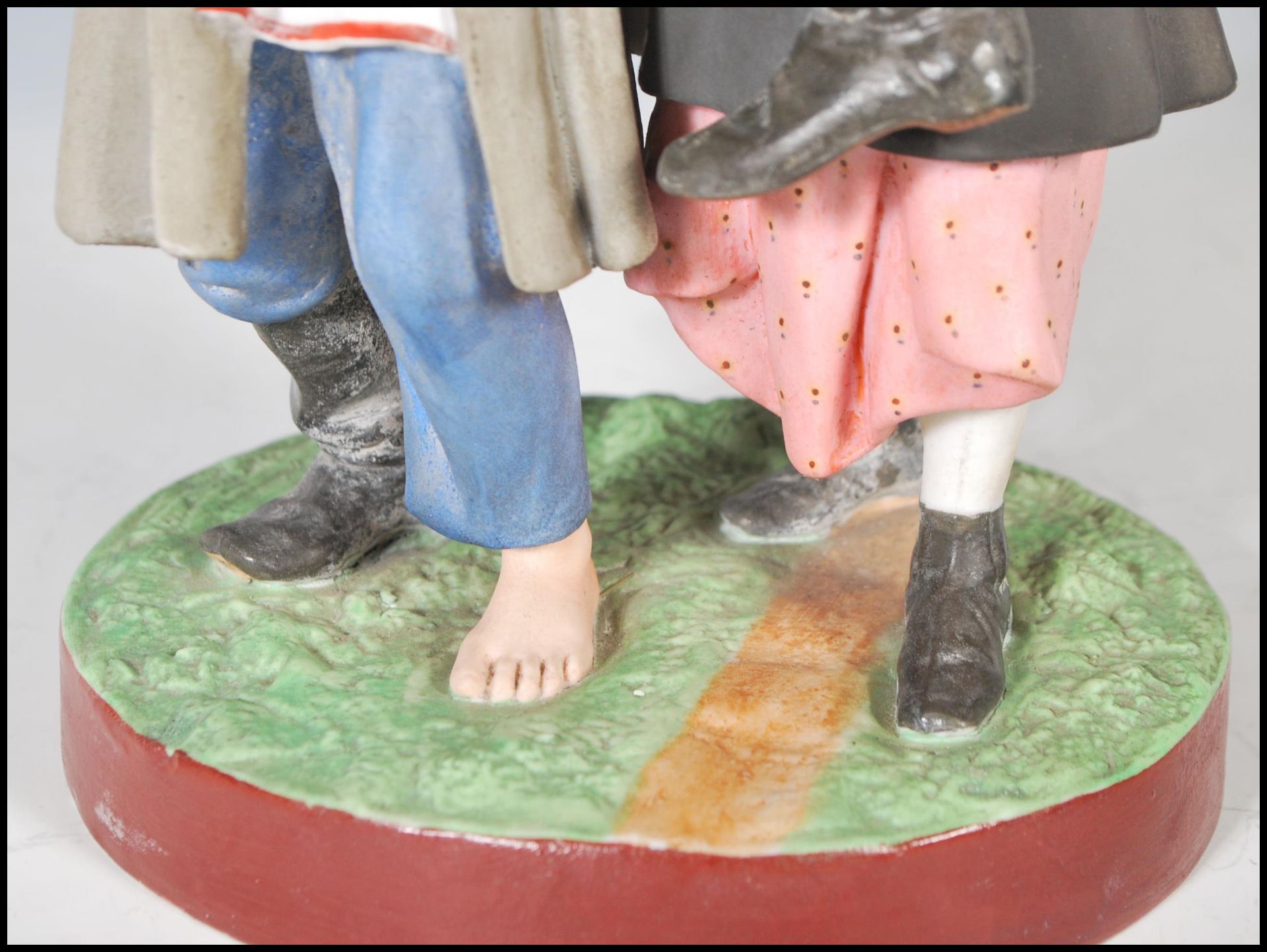 A 19th Century Russian Gardner bisque figurine group depicting a man with one boot and a bottle in - Bild 8 aus 10