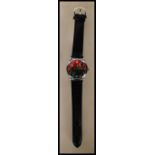 A gentleman's novelty wrist watch having a round red face printed with Chairman Mao having an