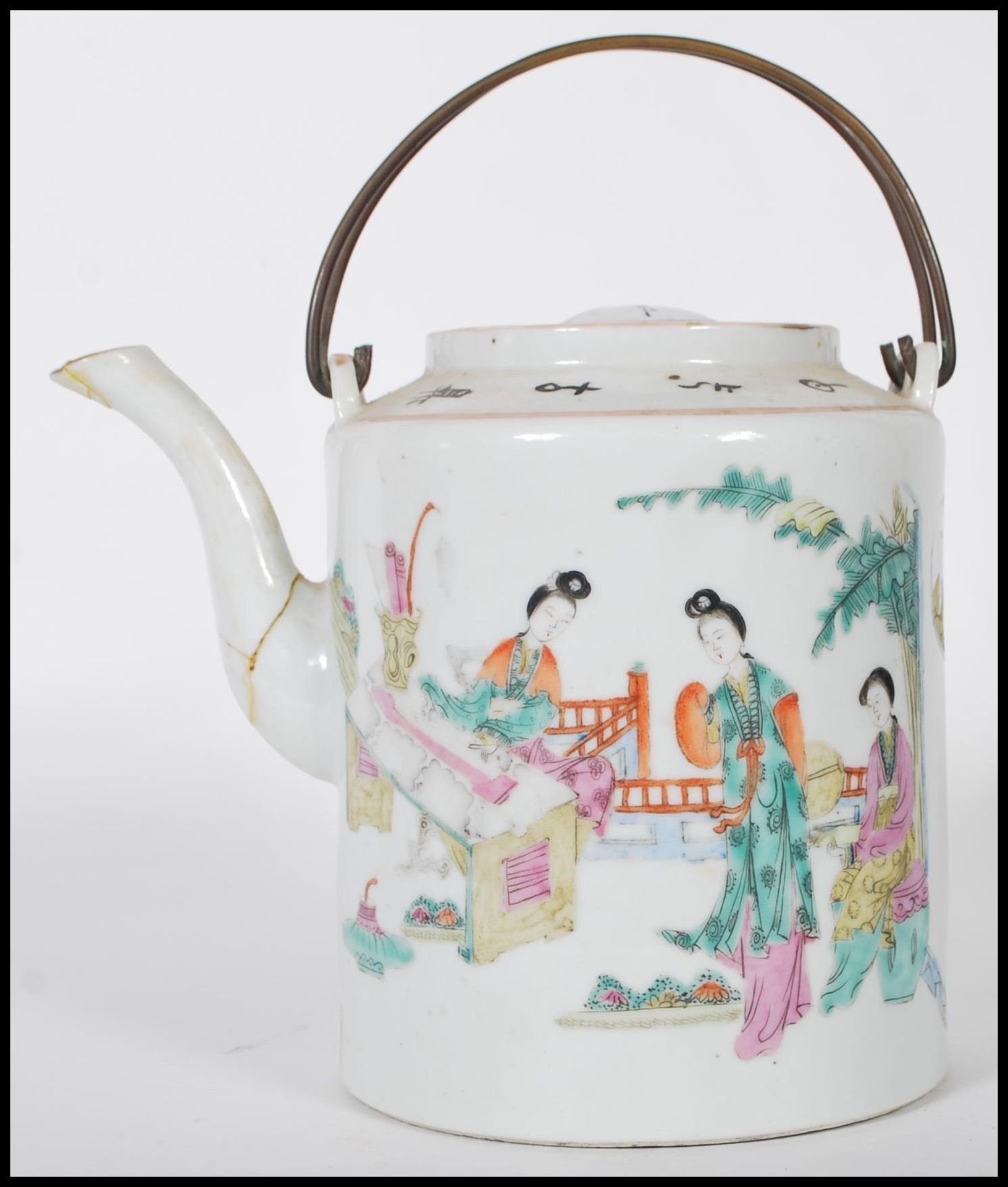 A 19th Century Chinese ceramic teapot of cylindrical form being hand painted with a domestic scene