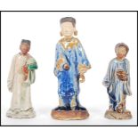 Two Chinese believed Ming dynasty tomb attendant funerary figures to include a green glazed male