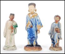 Two Chinese believed Ming dynasty tomb attendant funerary figures to include a green glazed male