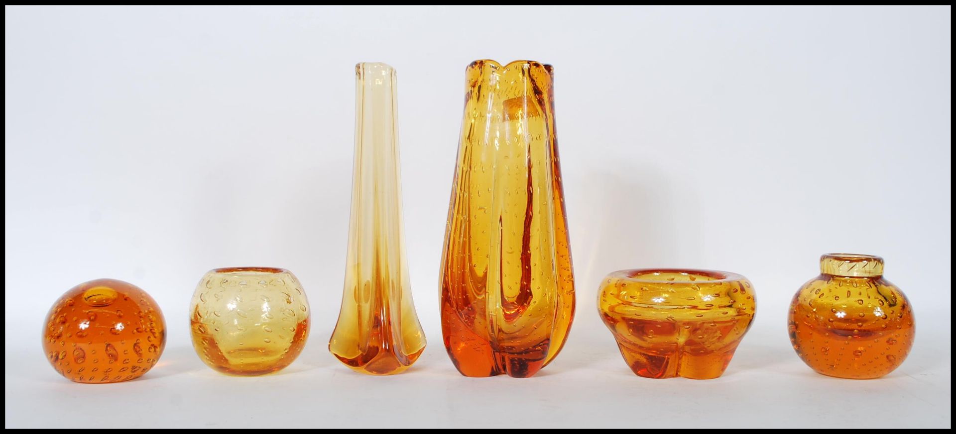 A selection of mid 20th Century vintage retro studio art amber glass to include a Geoffrey Baxter