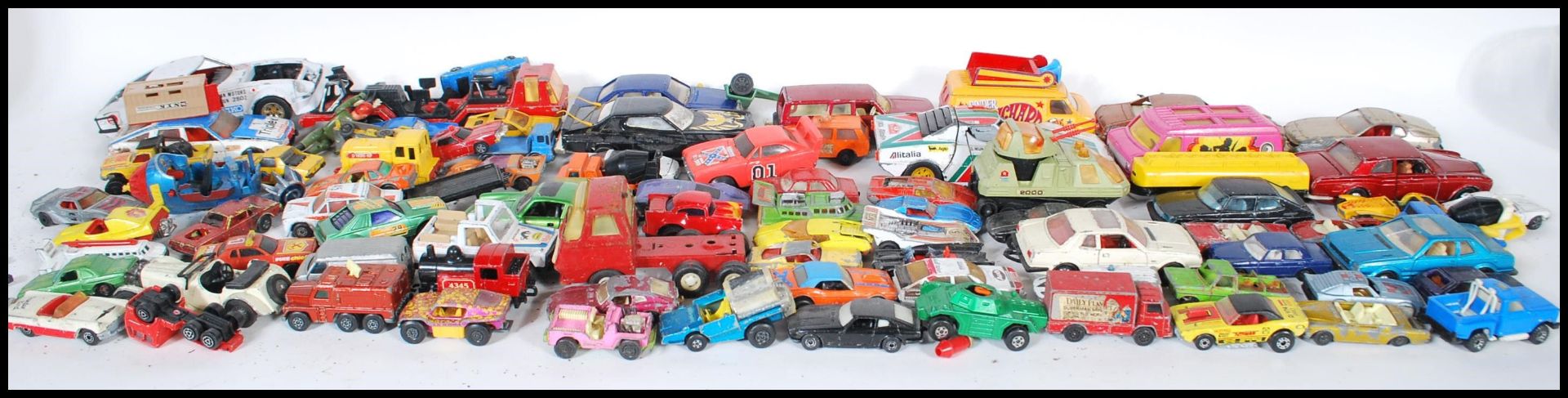 A COLLECTION OF DIECAST MODEL VEHICLES AND OTHERS