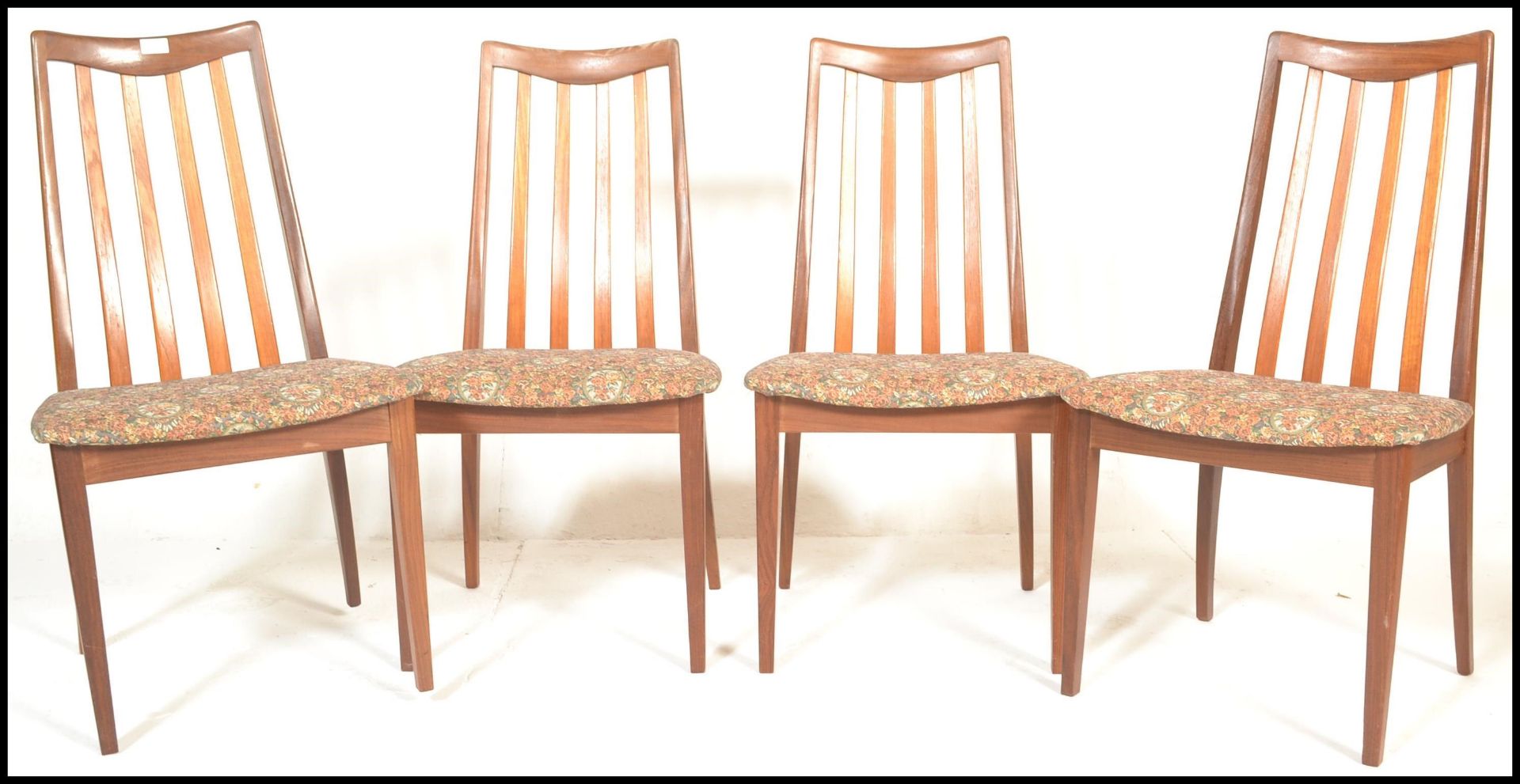 G Plan- A set of four retro mid 20th Century G Plan Fresco range tak wood rail back dining chairs