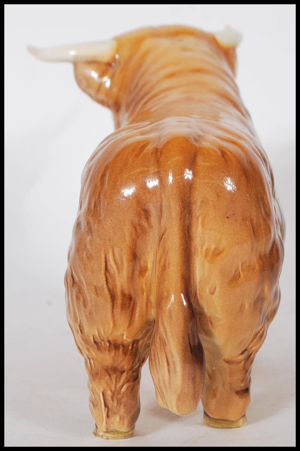 A Beswick ceramic figurine of a Highland cattle bull being stamped for Beswick, England to the foot. - Image 5 of 7