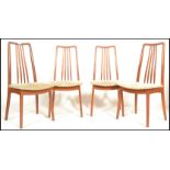 A set of four vintage retro mid 20th Century Danish dining chairs having teak wood frames raised