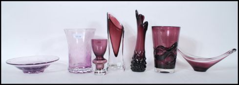 A collection of retro studio art amethyst glass vases and bowls to include a selection of