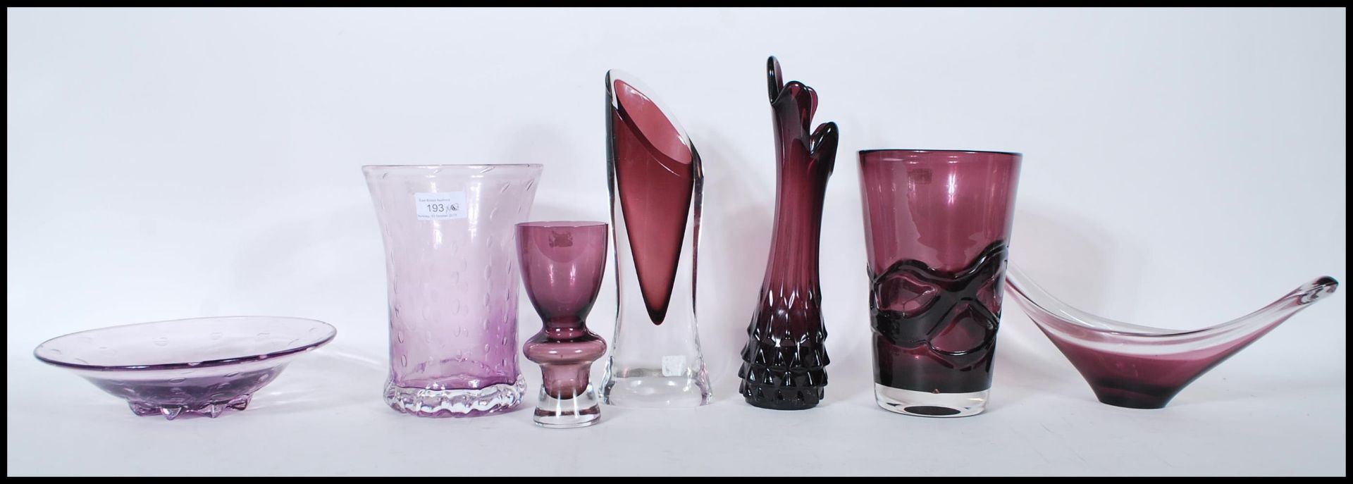 A collection of retro studio art amethyst glass vases and bowls to include a selection of