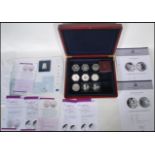 A collection of silver proof commemorative coins to include 1977 silver Jubilee x2, Britannia