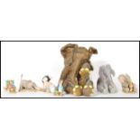A collection of composite figures to include Peter Rabbit figures x four, four x elephant figures