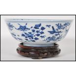 A 19th Century Chinese porcelain centrepiece blue and white bowl having being hand painted with