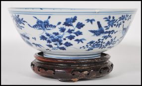 A 19th Century Chinese porcelain centrepiece blue and white bowl having being hand painted with