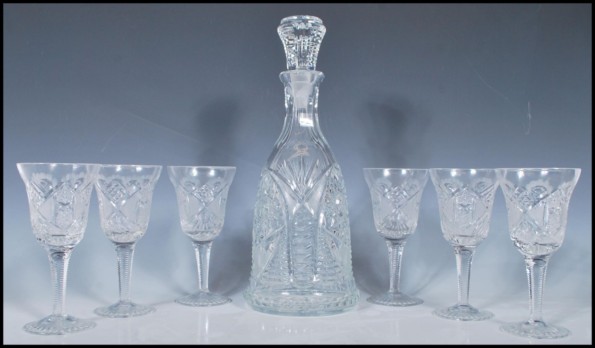 A 20th Century good quality cut glass bell decanter having cut starlike decoration throughout and