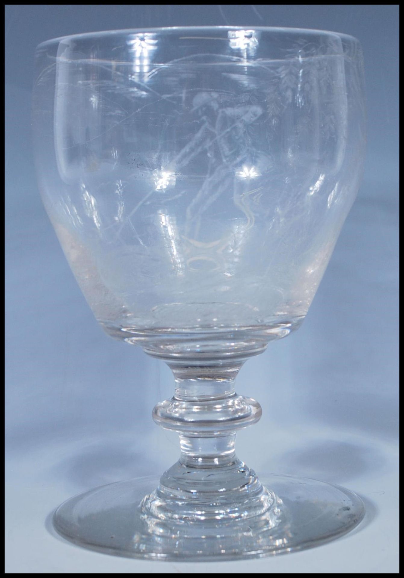 Hunting interest- An 18th/ early 19th Century Georgian glass goblet having finely engraved hunting