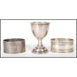 An early 20th Century silver hallmarked egg cup of simple form, hallmarks for Birmingham date letter