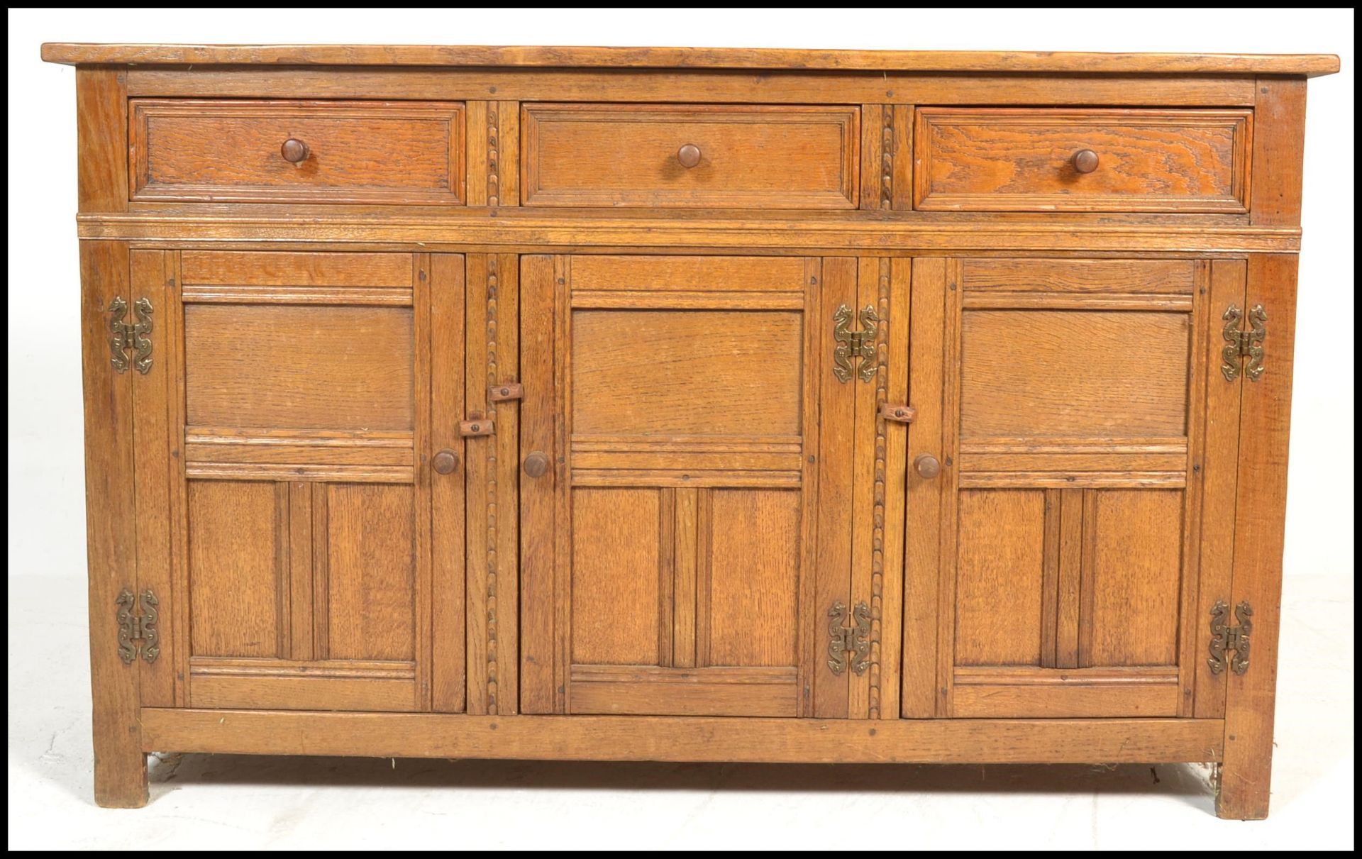 A 20th Century oak Jacobean revival sideboard credenza, flared top over a configuration of drawers - Image 2 of 6
