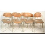 A set of 9 mid 20th century bentwood and tubular metal industrial stacking chairs. Each with painted