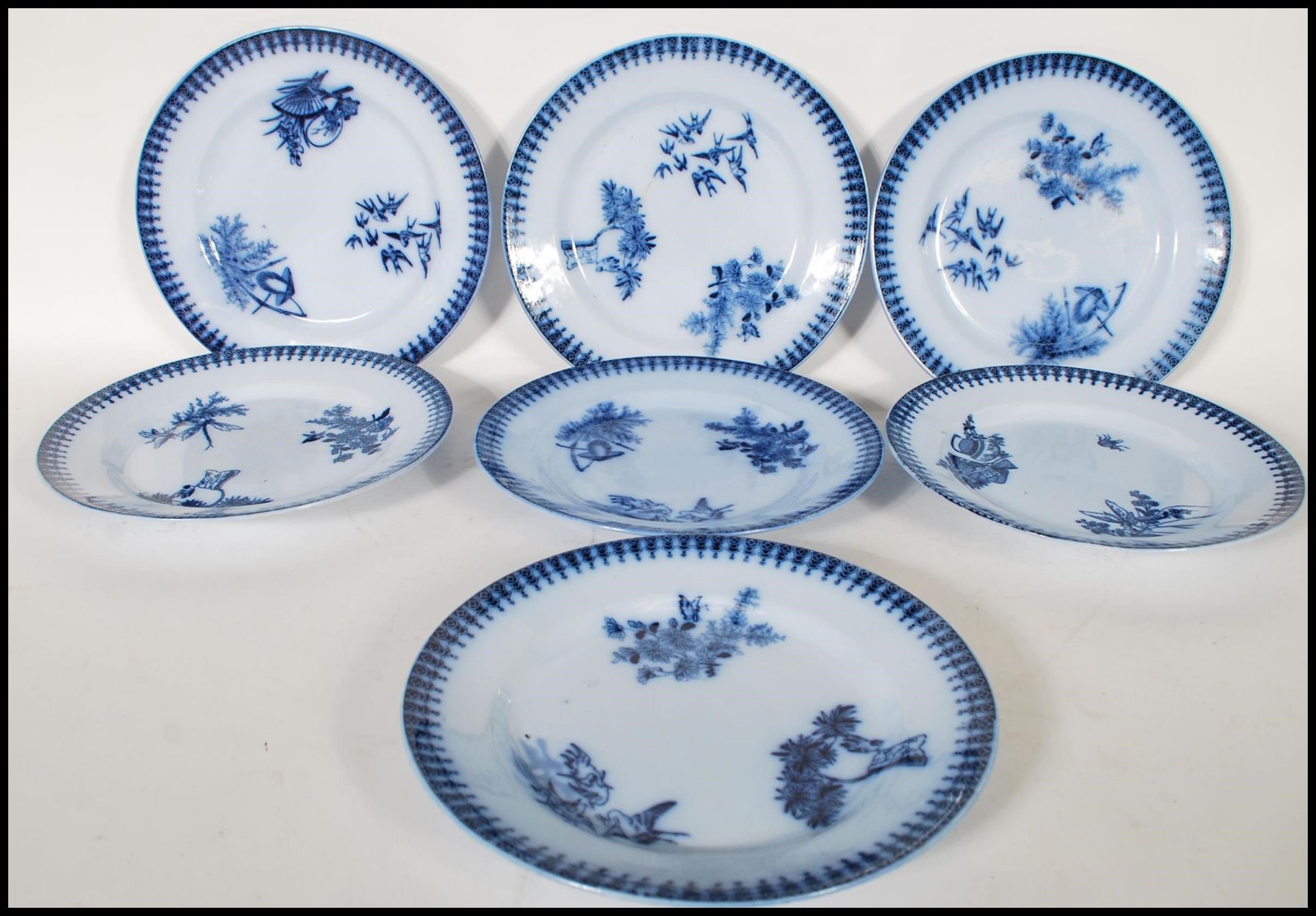 A matching set of seven early 20th Century blue and white dinner plates having blue pattern