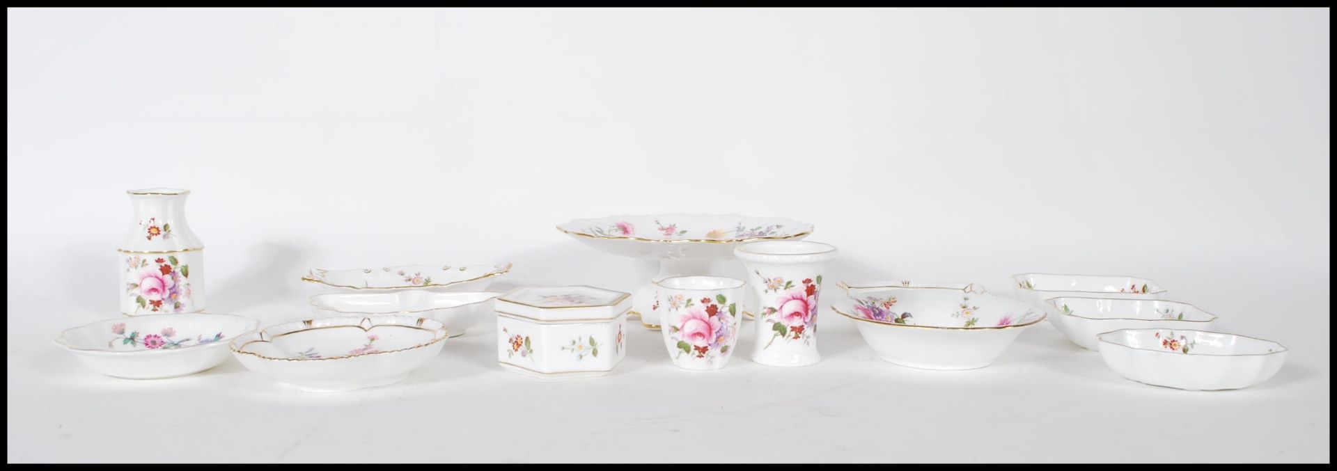A collection of fourteen pieces of bone china by Royal Crown Derby, all decorated with fauna and