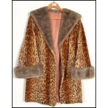 A vintage 20th Century ladies three quarter length beaver lamb jacket / coat, the coat with an