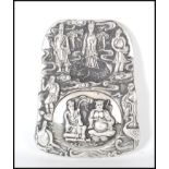 A Chinese white silver inkwell of ingot form, cast in relief with elders and Crane's central