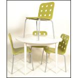 A 20th Century circular white dining table together with a set of four contemporary dining chairs in