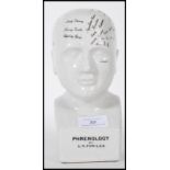A 20th Century antique style phrenology head having a white crackle glaze with labelling to the