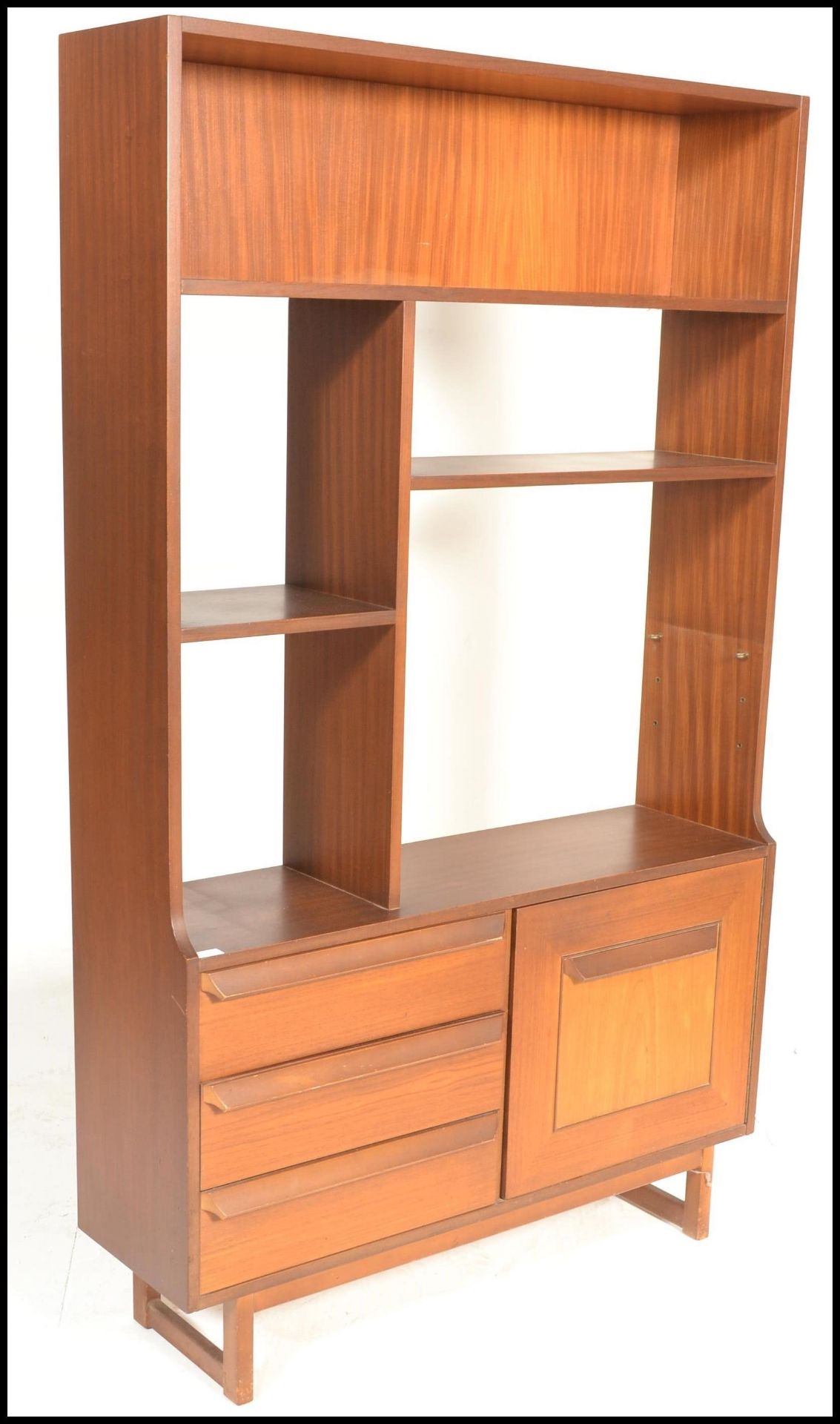 A retro mid 20th Century teak wood room unit having fitted shelves with one being adjustable above a