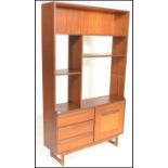 A retro mid 20th Century teak wood room unit having fitted shelves with one being adjustable above a
