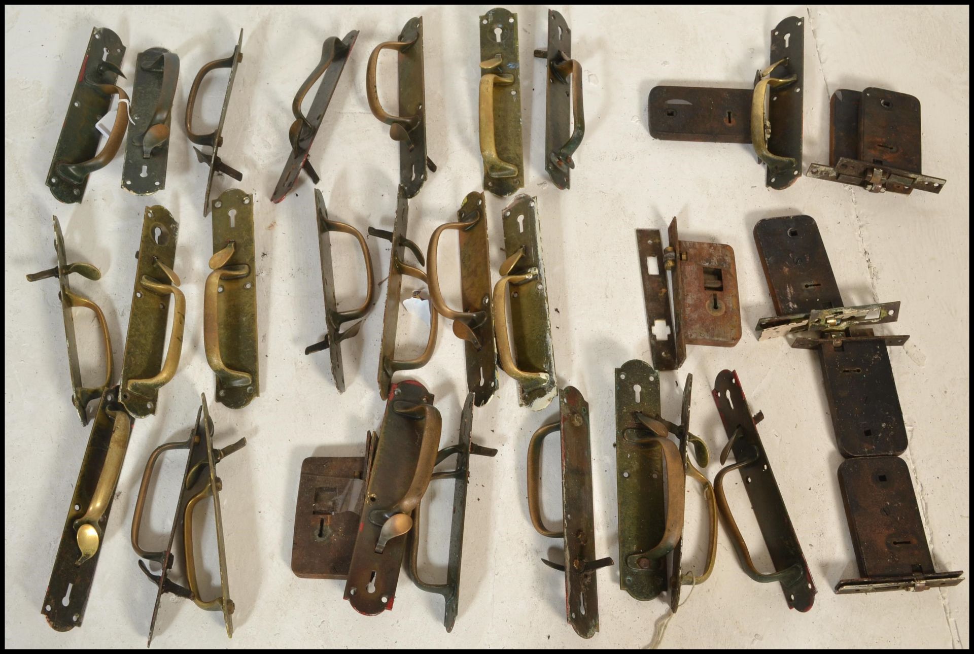A collection of 19th Century Victorian brass door / furniture pull handles and back plates. The