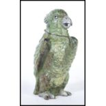 A German cold painted bronze inkwell in the form of a parrot finished in a green colourway with