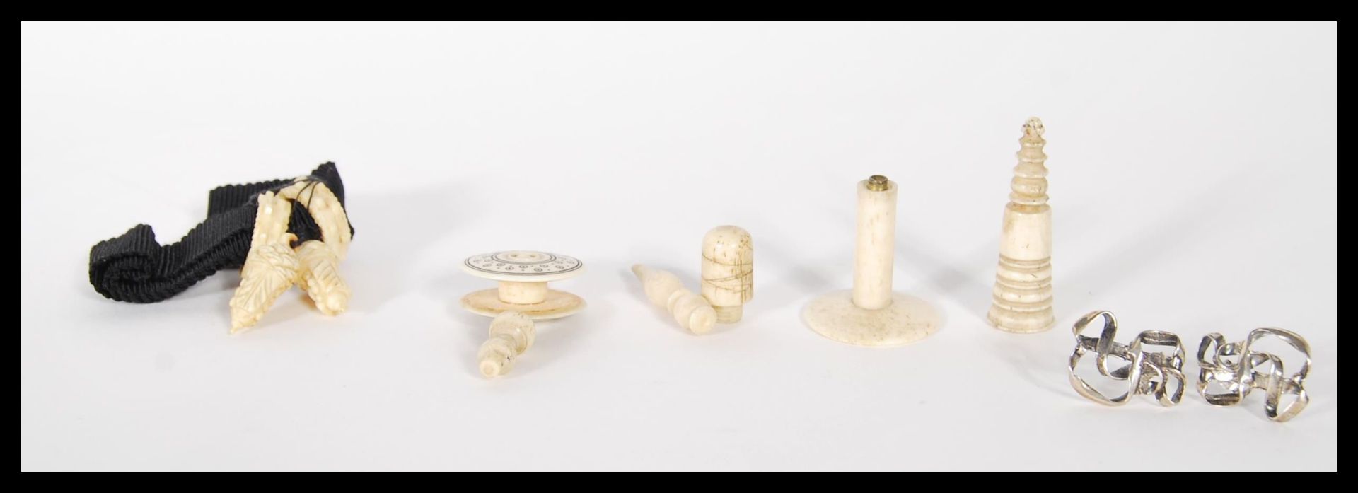 A collection of Victorian 19th Century Ivory items to include chess piece, thimble, thread holder