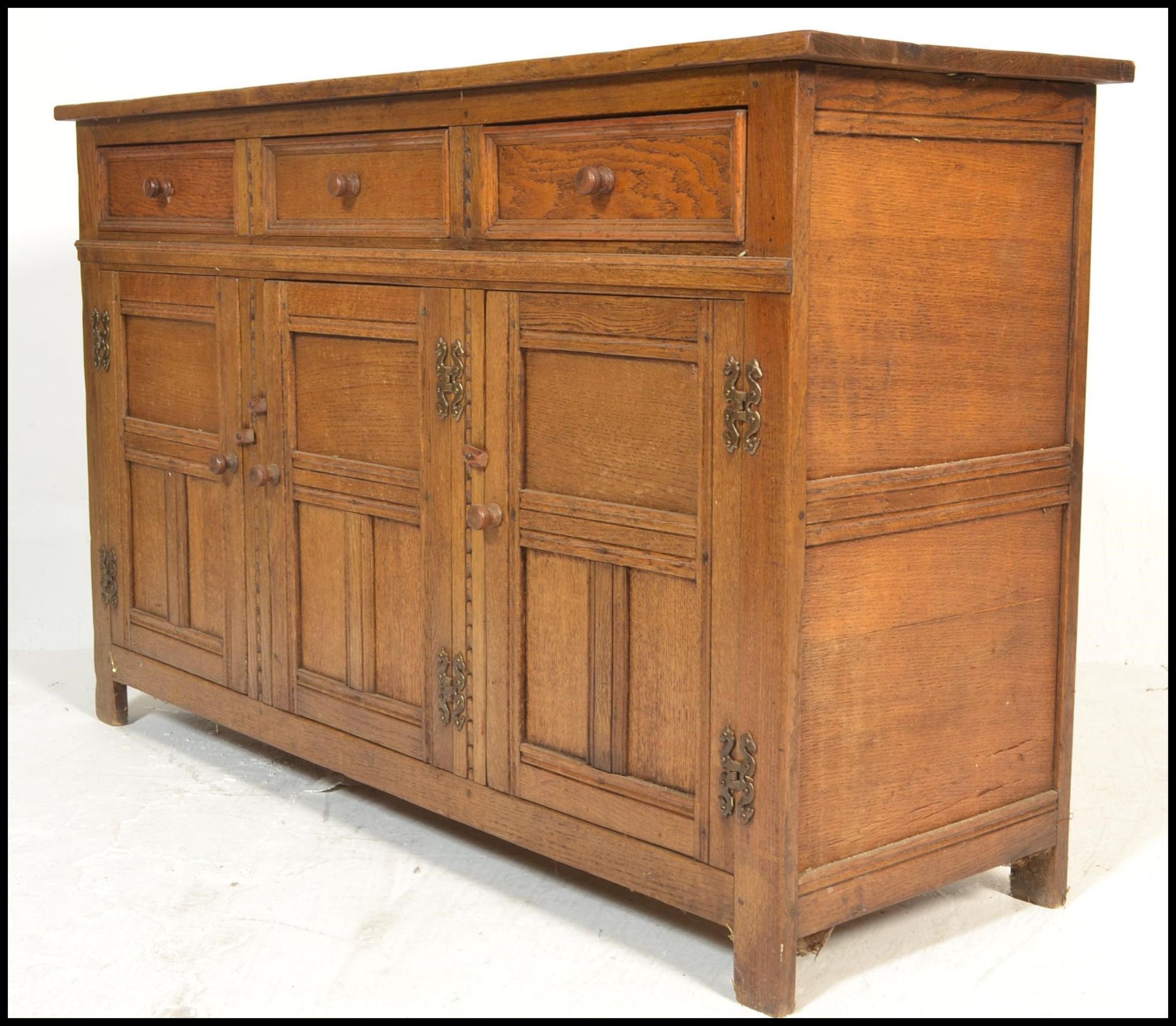 A 20th Century oak Jacobean revival sideboard credenza, flared top over a configuration of drawers - Image 3 of 6