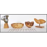 A collection of 20th Century treen items to include a burr walnut trinket bowl having a cast