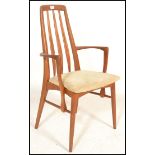 A retro 20th Century Kofod Larsen teak wood open framed elbow Chair together with a set of three dot