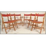 A set of 6 mid 20th century bentwood and tubular metal industrial stacking chairs. Each with painted