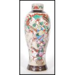 A 20th Century Chinese vase of tapering waisted form having a cream crackle glaze with hand